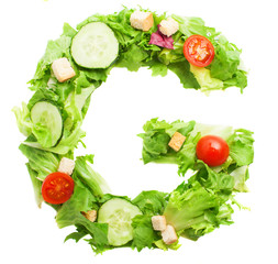 G letter made with salad isolated on white
