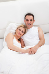 Couple On Bed Together
