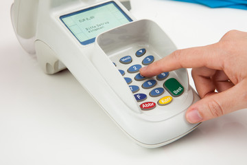 Finger Entering The Pin Code In Card Reader Machine