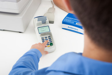 Finger Entering The Pin Code In Card Reader Machine