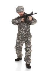 Young Soldier Aiming With Gun