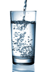 water pouring in glass isolated on white background