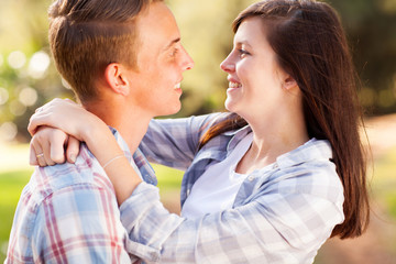Fototapeta premium teenage couple looking at each other with love