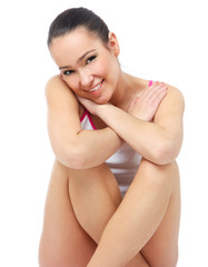 Fototapeta premium Young woman in night wear sitting on floor