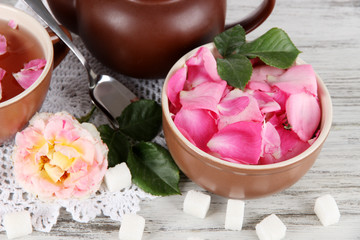 Kettle and cup of tea from tea rose