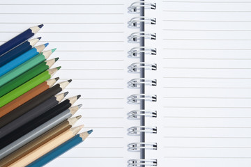 Note book and colored pencils