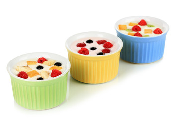 Delicious yogurt with fruit isolated on white