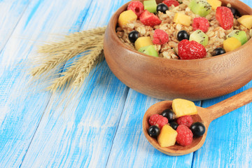 Oatmeal with fruits on table close-up