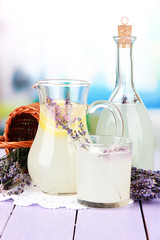 Lavender lemonade in glass bottle and jug,