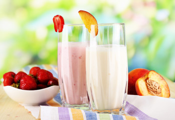 Delicious milk shakes with strawberries and peach