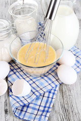 Ingredients for dough on wooden table close-up