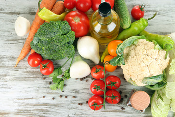 Fresh vegetables in basket on wooden table close-up