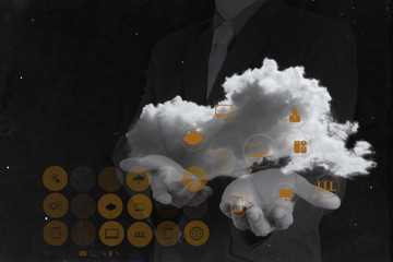 Businessman working with a Cloud Computing diagram on the new co