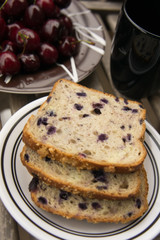 Blueberry bread with red cherries and tea