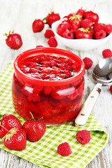 Home made berry jam on wooden table