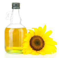 Oil in jar and sunflower isolated on white