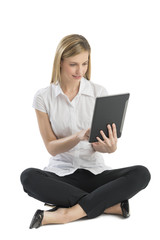 Naklejka premium Businesswoman Using Digital Tablet While Sitting On Floor