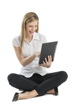 Businesswoman Using Digital Tablet While Sitting On Floor