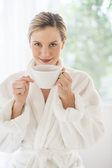 Attractive Woman With Coffee Cup At Health Spa
