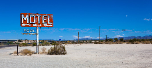 A vintage neon motel sign in the desert