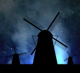 Foto op Plexiglas Molens Silhouettes of windmills on night sky