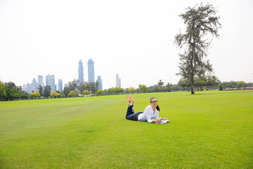 Fototapeta premium woman with laptop in park
