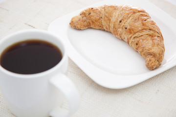 Croissant and a cup of coffee