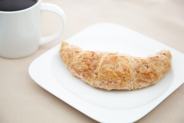 Croissant and a cup of coffee