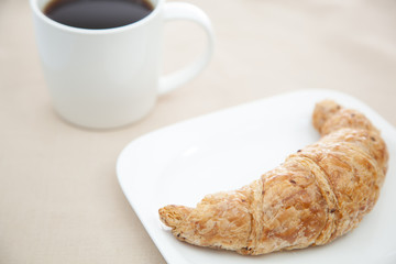 Croissant and a cup of coffee