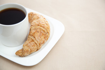 Croissant and a cup of coffee