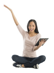 Cheerful Woman With Hand Raised Holding Digital Tablet