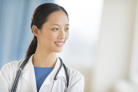 Thoughtful Female Doctor Looking Away