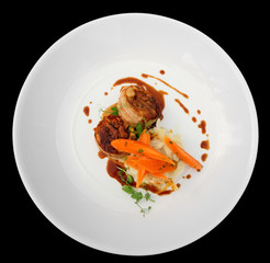 Rabbit meat wrapped in bacon and grilled