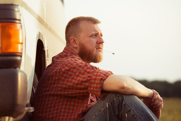 Red-bearded man on a summer evening