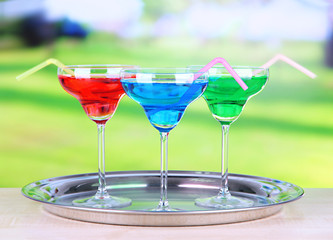 Different cocktails on bright background