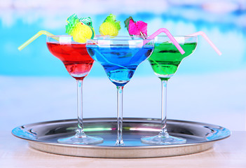 Different cocktails on bright background
