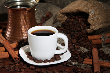 Metal turk and coffee cup closeup