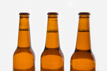 Three brown beer bottles