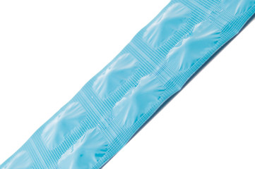Closed up side of tablet in blue aluminum foil strip