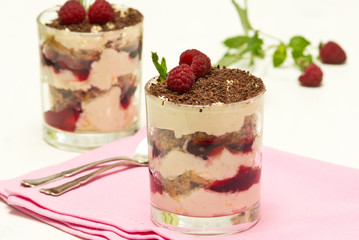 Yoghurt (creme fraiche) dessert with raspberries, decorated with