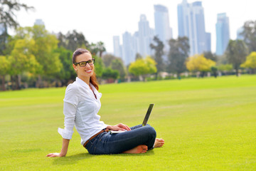 Fototapeta premium woman with laptop in park