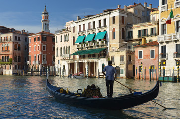 Fototapeta na wymiar Gondola on Grand Canal in Venice, Italy