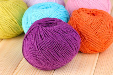 Knitting yarn on wooden background