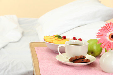 light breakfast on the nightstand next to the bed