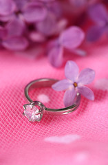 Beautiful wedding ring on pink background