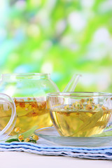 Kettle and cup of tea with linden