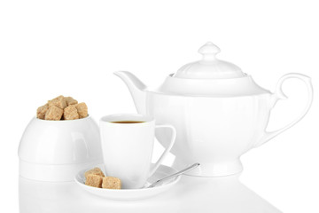 Cup of coffee, sugar-bowl and teapot isolated on white