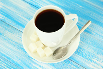 Cup of coffee, on color wooden background