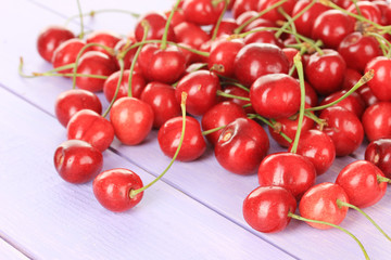 Obraz na płótnie Canvas Cherry berries on wooden table