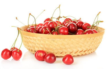 Cherry berries in wicker basket isolated on white